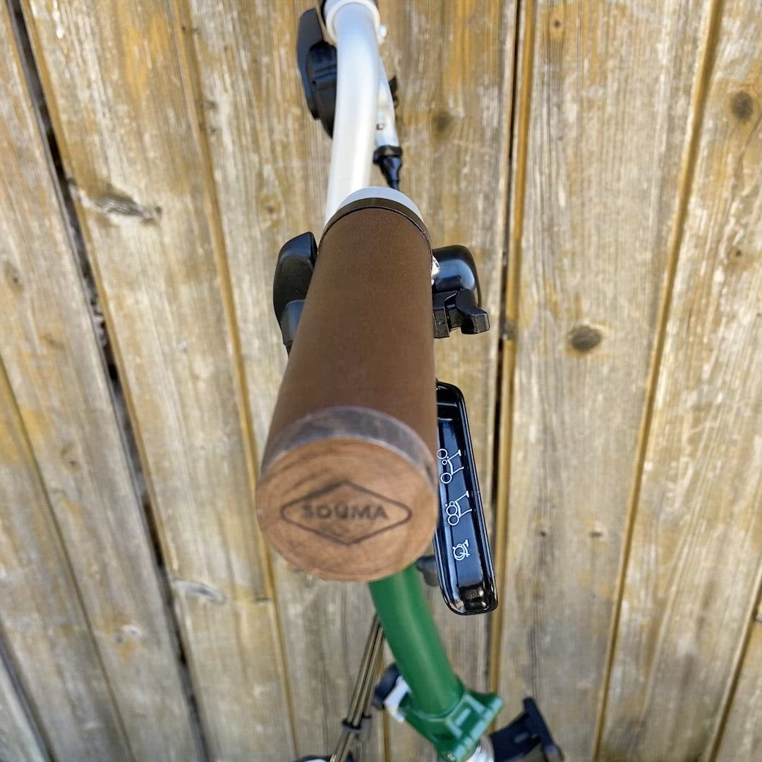 Video showing both Leather Handlebar Grips for Brompton bicycle featuring close-up of the leather and beech wood plugs