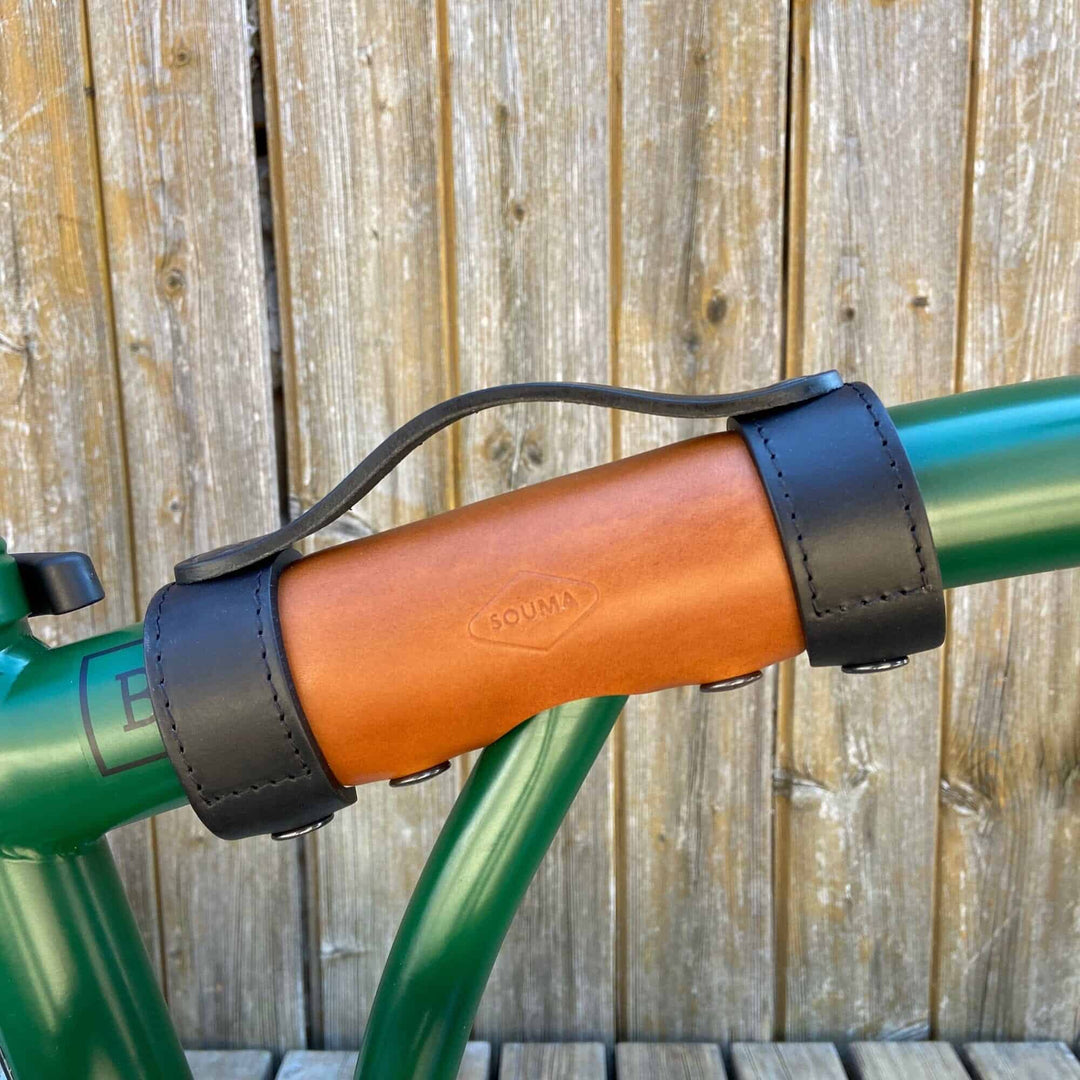 Black and honey carry handle on Brompton Bike