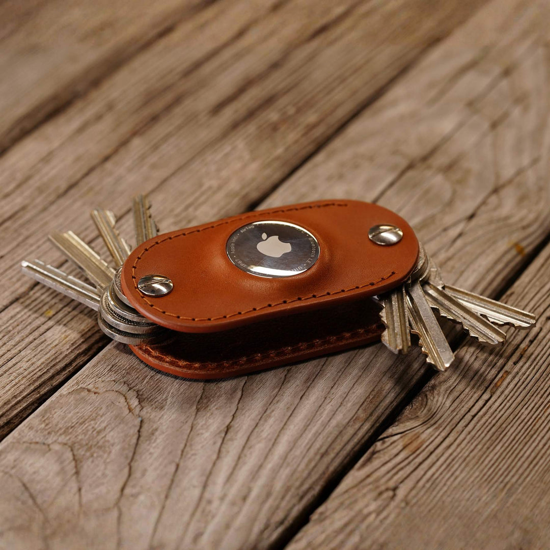 AirTag key organizer in honey on wooden BG