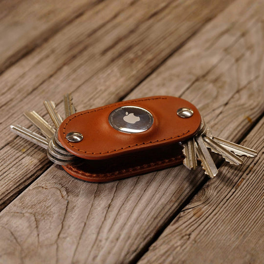 AirTag key organizer in honey on wooden BG