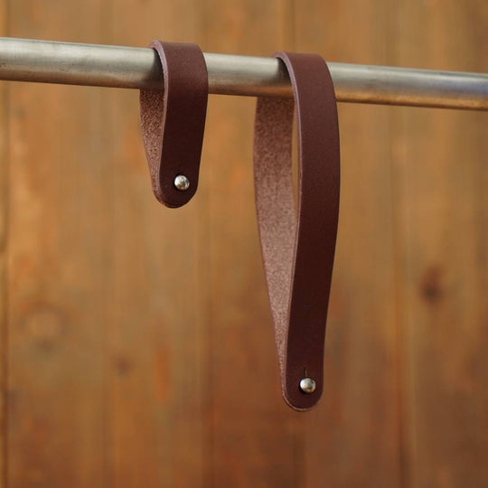 Pair of brown leather hub shiners on tube