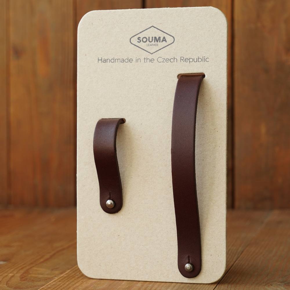 Pair of brown leather hub shiners in packaging  