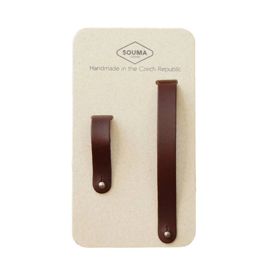 Pair of brown leather hub shiners in packaging  on white background