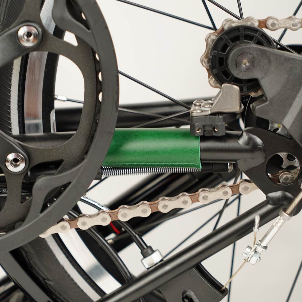 green leather chain and hook protector on Brompton close up 