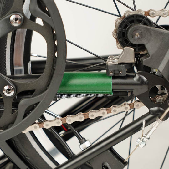 green leather chain and hook protector on Brompton close up 