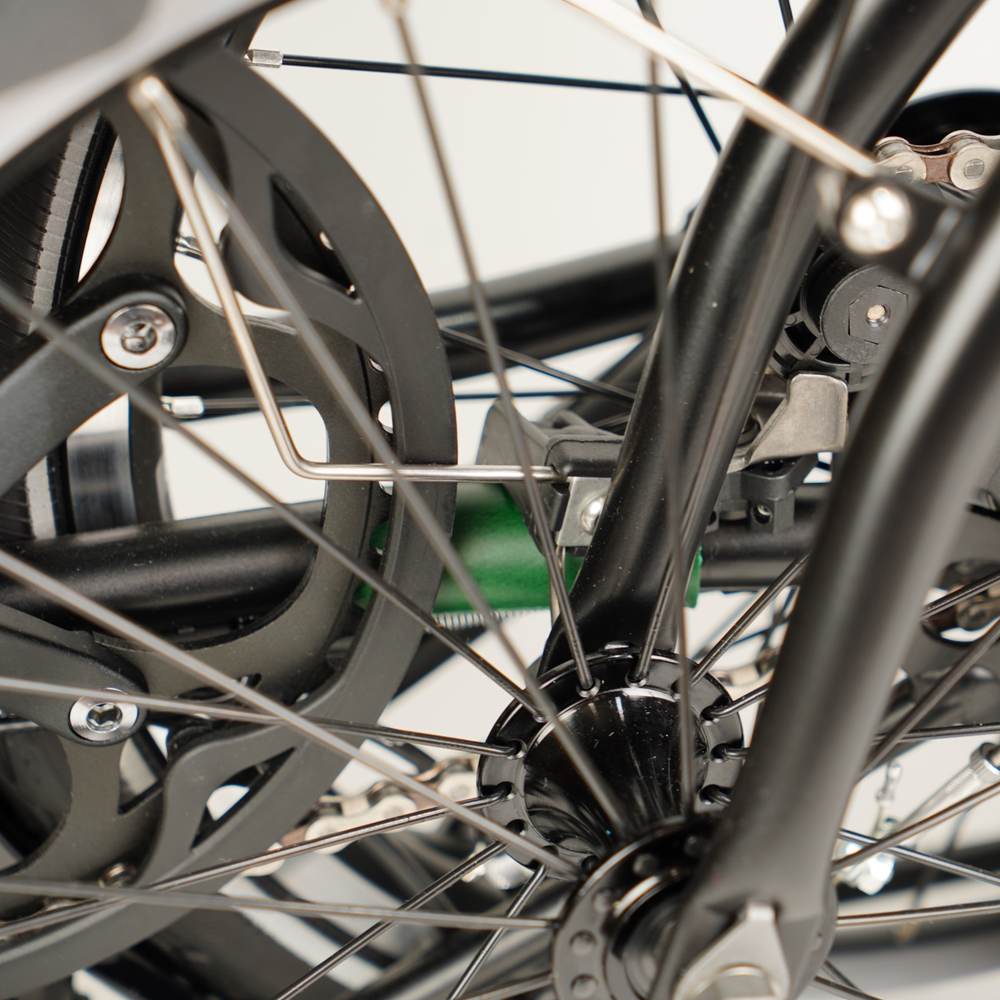 green leather chain and hook protector on folded Brompton close up 