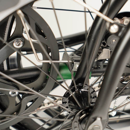 green leather chain and hook protector on folded Brompton close up 
