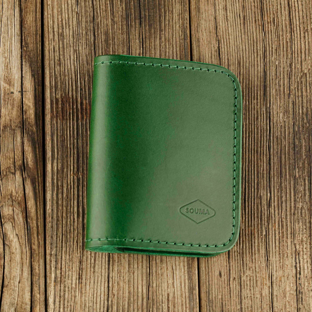 Bifold Apple AirTag Leather Wallet Green wooden background