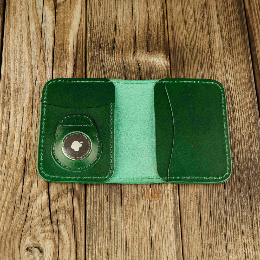 Bifold Apple AirTag Leather Wallet Green wooden background, open, with airtag