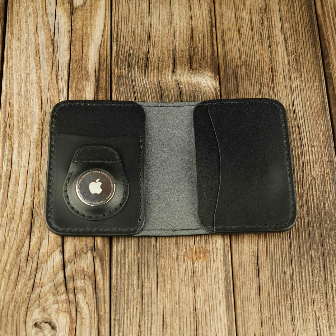 Bifold Apple AirTag Leather Wallet Black wooden background, open, with airtag