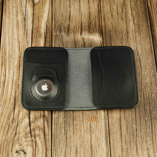 Bifold Apple AirTag Leather Wallet Black wooden background, open, with airtag