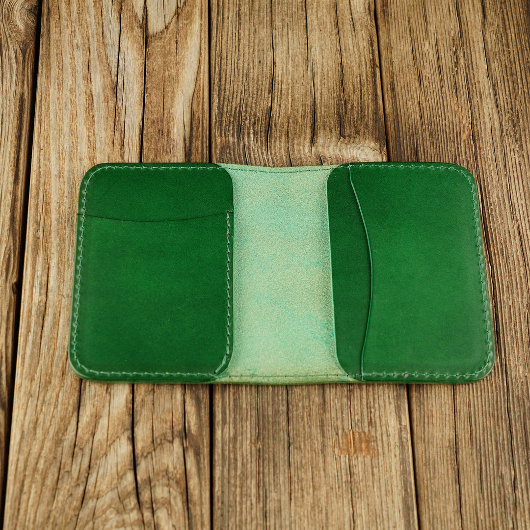 Bifold Apple AirTag Leather Wallet Green wooden background, open