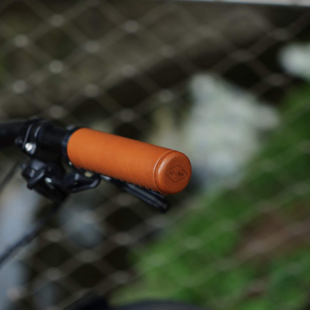 Close-up of an honey bicycle handlebar grip with a blurred background