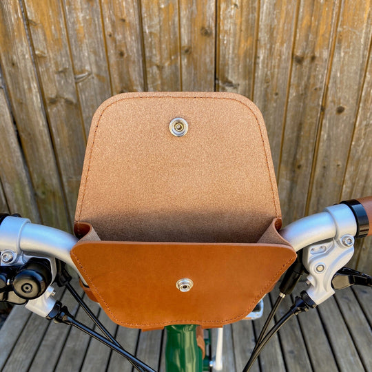 Brompton Bag for handlebars Souma Leather Honey Silver open on Brompton bicycle